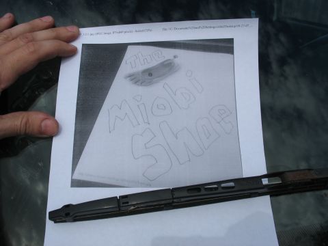 1978 Ford Bronco - A document with a drawing and text is placed on a surface, partially obscured by a windshield wiper.