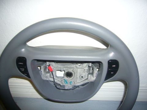 2000 Ford Crown Victoria - Steering wheel with cruise control buttons visible.
