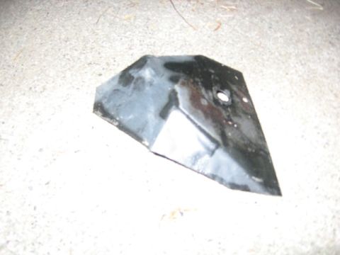 1989 Ford Bronco - A single black metal bracket is shown on a concrete surface.