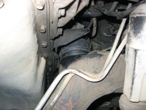 1989 Ford Bronco - This photo shows a close-up view of a vehicle's engine mount, focusing on the rubber dampening component.