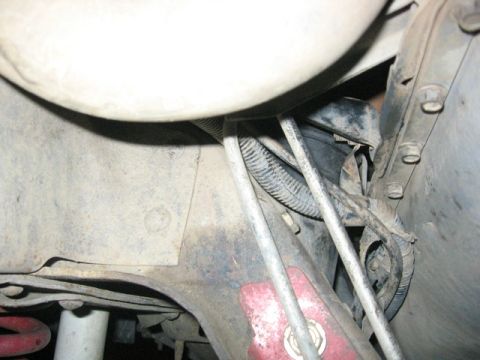 1989 Ford Bronco - Close-up of engine mounts and associated wiring, with visible signs of wear and tear.