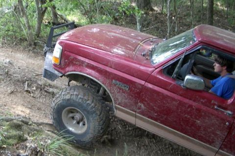 1995 Ford Bronco - This 1995 Ford Bronco is shown off-road with a custom front bumper and large tires.