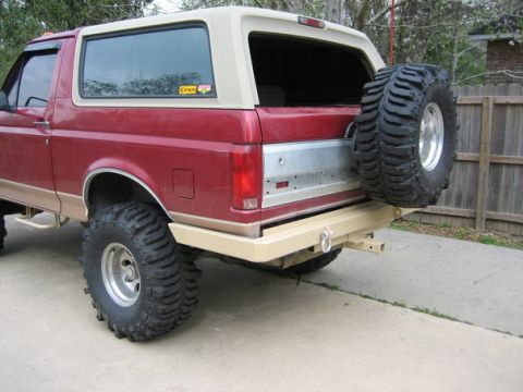 1995 Ford Bronco - This Ford Bronco has a spare tire mounted on the rear and an aftermarket bumper.