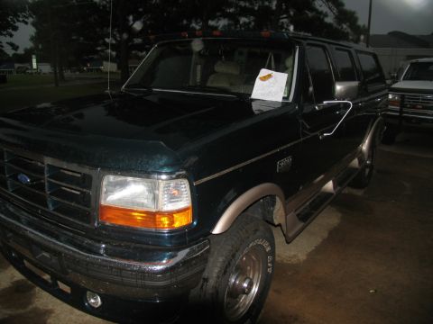1978 Ford Bronco - This Ford Bronco SUV is parked next to another vehicle.