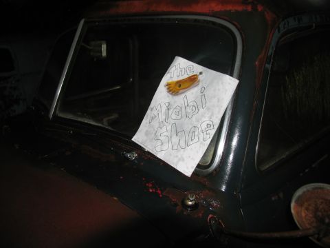 1978 Ford Bronco - A handwritten sign is taped to the window of an old car.