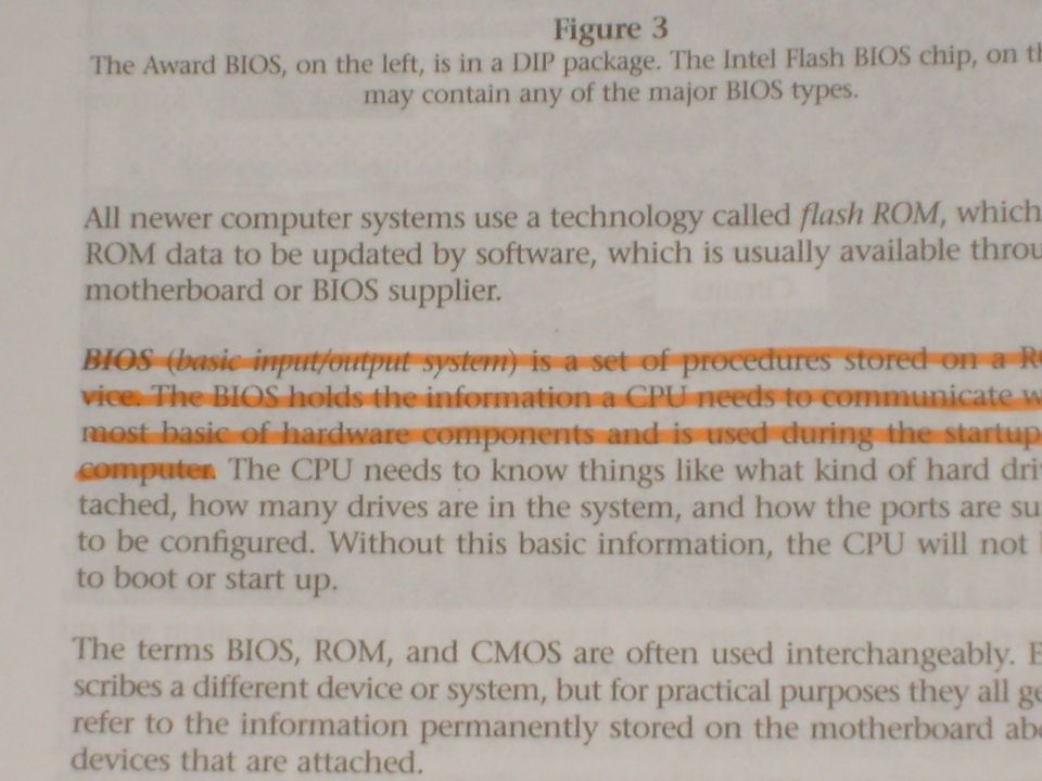 Document page with text about computer BIOS and flash ROM, with orange highlighting