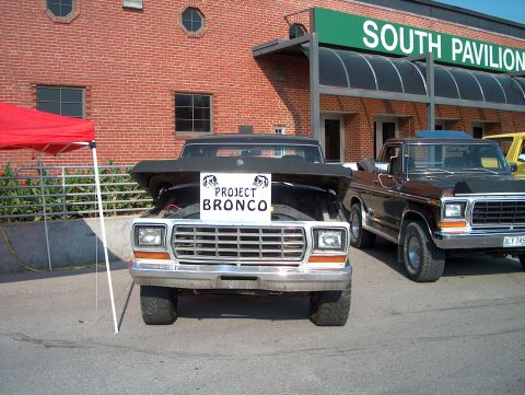1978 Ford Bronco - A 1978 Ford Bronco is displayed with its hood open, a sign that reads "Project Bronco".