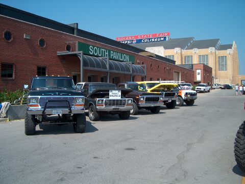 1978 Ford Bronco - A line of Ford trucks and Broncos are parked outside the South Pavilion at the Indiana State Fairgrounds.