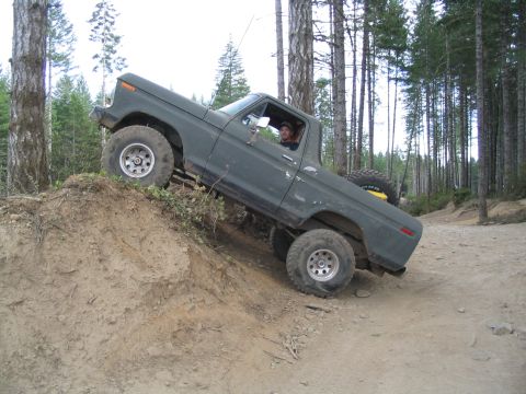 1989 Ford Bronco - This 1979 Ford F-Series truck is navigating a challenging off-road trail.