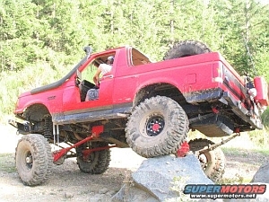 1986 Ford Bronco - This heavily modified SUV is equipped for extreme off-roading with a snorkel and lifted suspension.