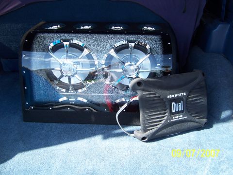 1996 Ford Bronco - A custom car audio setup two large subwoofers and a Dual amplifier is visible in the rear of a vehicle.