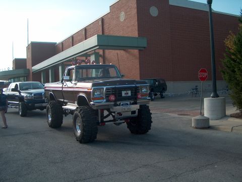 1978 Ford Bronco - This lifted 1978 Ford pickup truck has a custom grille and large off-road tires.