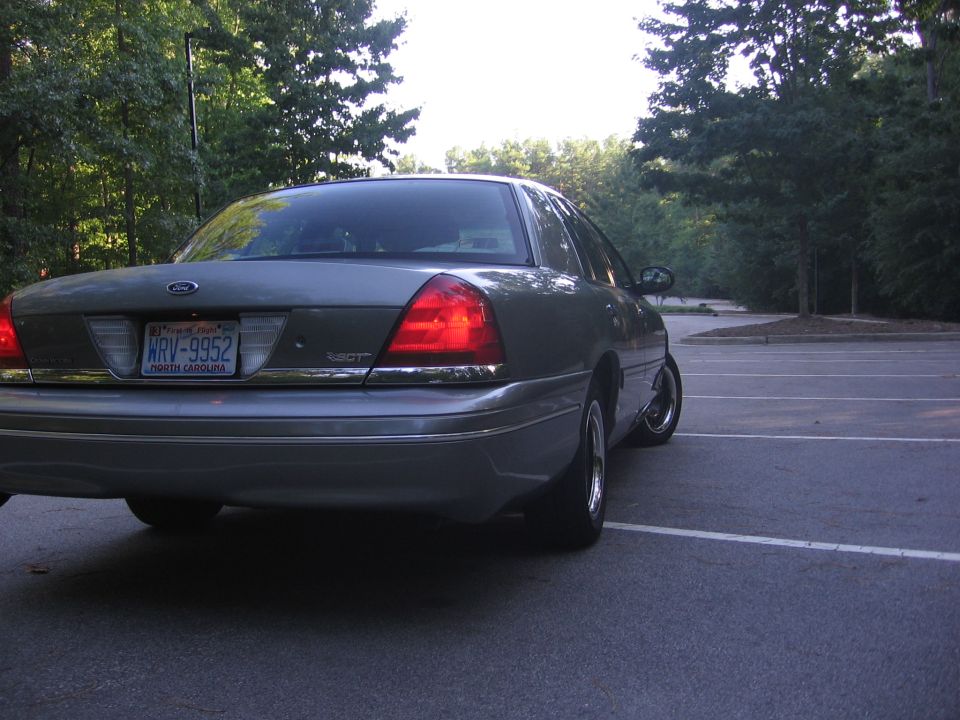 Rear view of a gray 2000 Ford Crown Victoria with a license plate reading KRV-9952