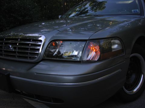 2000 Ford Crown Victoria - Front view of a 2000 Ford Crown Victoria, highlighting its grille and headlight assembly.