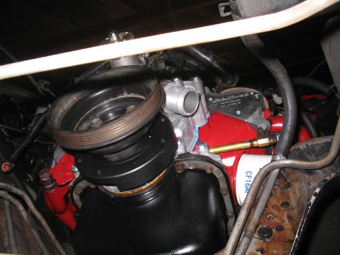 1989 Ford Bronco - Engine components visible: oil pan, red block, and oil filter. The oil filter has 'CF16A' printed on it.