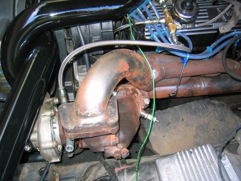 1981 Ford LTD - Drivers side header, almost done fabricating. You can see the oil supply for the turbos and I haven't yet made the sparkplug wire separator…