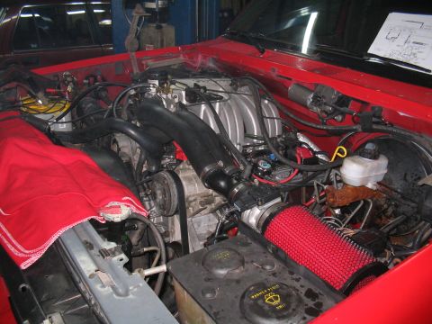 1989 Ford Bronco - Engine bay with red engine cover and aftermarket air filter visible.