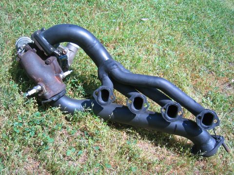 1981 Ford LTD - Passenger side header and turbo unit showing the relationship between these parts on the car. You can't actually put it on like this but th…
