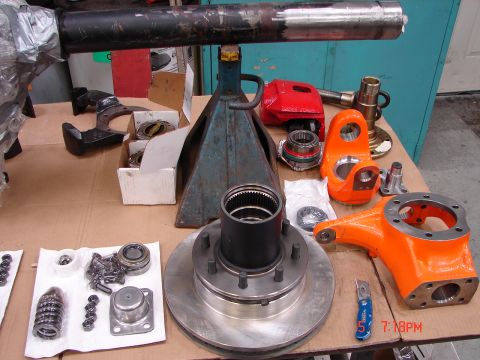 1989 Ford Bronco - Various Dana 60 front axle components are displayed, suggesting a rebuild or upgrade project.