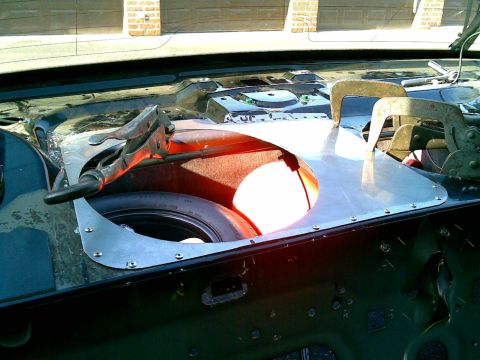 2003 Ford Crown Victoria - the deck was too irregular to mount the passenger side sub. here the patch panel is clamped and popping in.