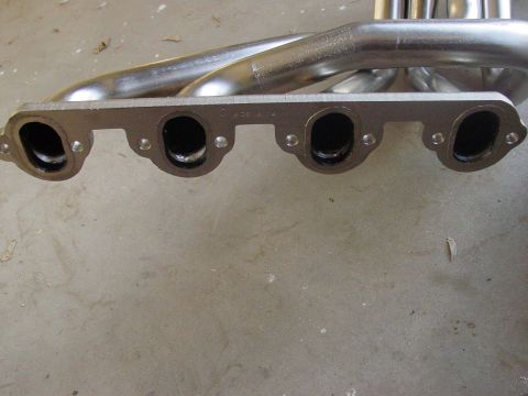 1979 Ford Bronco - Close-up of an exhaust manifold, showing the port openings and tubing.