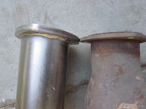 1979 Ford Bronco - Comparison of a new exhaust pipe flange next to a rusted, older one.