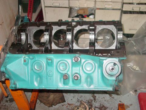 1979 Ford Bronco - Engine block with crankshaft bearings visible, painted teal.