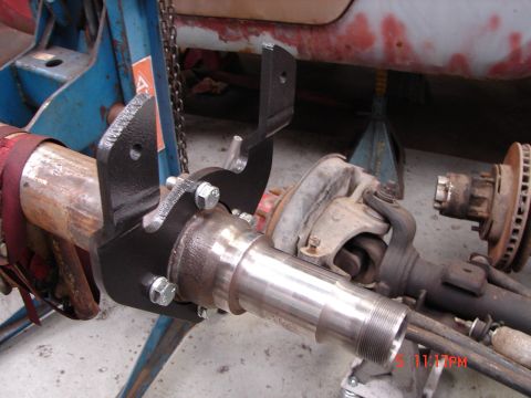 1989 Ford Bronco - Close-up view of a vehicle's axle assembly, showing newly installed brackets and suspension components.