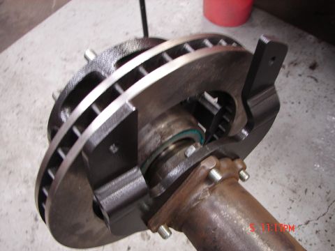 1989 Ford Bronco - Close-up view of a brake rotor and caliper assembly attached to an axle tube, with a timestamp visible in the corner.