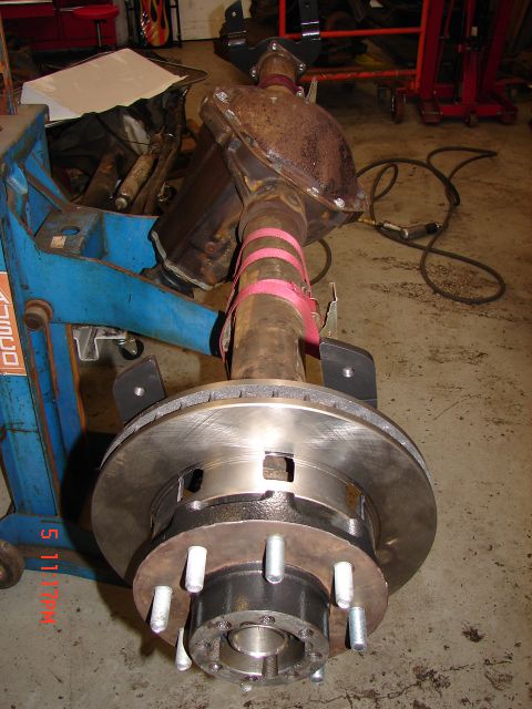 1989 Ford Bronco - Close-up of a rear axle assembly, likely for a truck or SUV, with disc brakes.