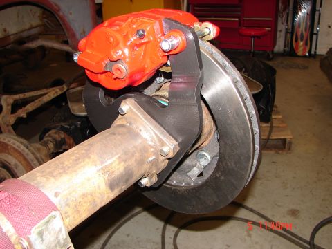 1989 Ford Bronco - Close-up of a vehicle's rear axle assembly, showing a newly installed disc brake system.