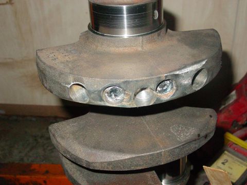 1979 Ford Bronco - Close-up view of a crankshaft, showing drilled counterweights.