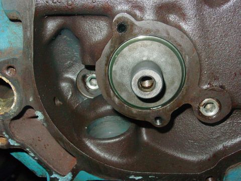 1979 Ford Bronco - Close-up view of an engine block's water pump housing, showing the mounting area and gasket.