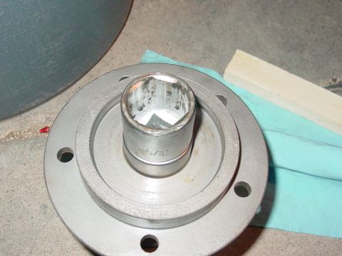 1979 Ford Bronco - A socket wrench is shown fitted into a wheel hub assembly, suggesting a repair or maintenance task.