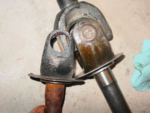 1979 Ford Bronco - Two driveshaft universal joints are shown, one appearing to be in rougher condition than the other.