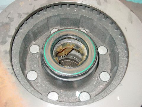 1979 Ford Bronco - Wheel hub assembly with visible grease and part number CR 27432 USA.