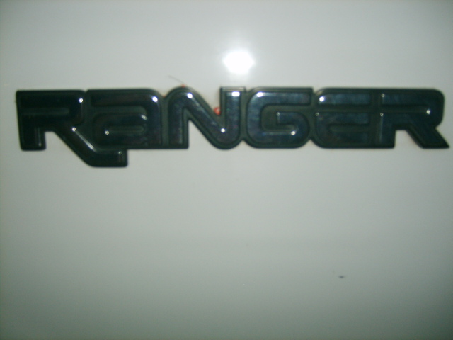 Black Ranger emblem on a white surface