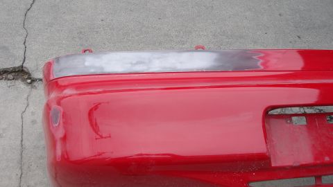 1996 Ford Probe - Shaving the badges off the back bumper.