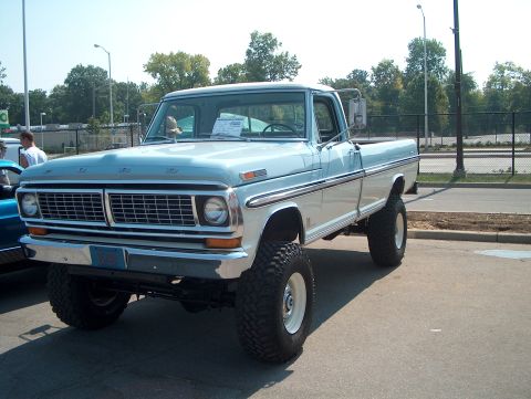 1978 Ford Bronco - This lifted 1970 Ford pickup truck features a distinctive grille and two-tone paint scheme.