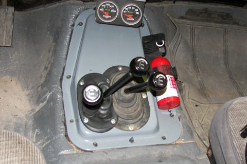1988 Ford Bronco - Close-up of the center console and dashboard gauges in a vehicle.