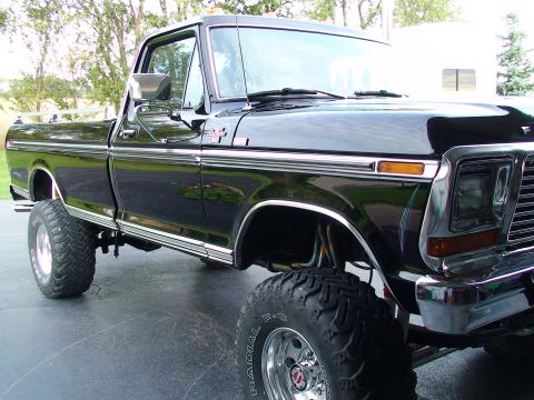 1979 Ford F-250 - A black 1979 Ford F-250 pickup truck is shown from a three-quarter front angle.