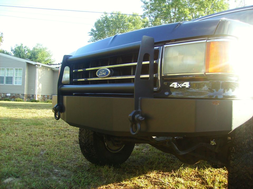 Black 1990 Ford Bronco front with brush guard and 4x4 badge