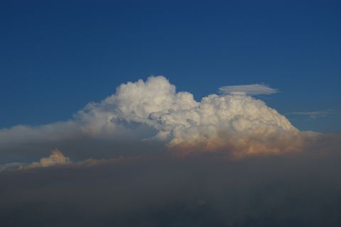 1996 Ford Bronco - Dramatic storm clouds gather under a clear blue sky, with the Supermotors logo visible at the bottom right.
