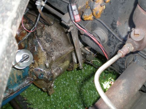 1966 Ford Mustang - Engine and transmission components are shown in this close-up view, with various wires and hoses connected.