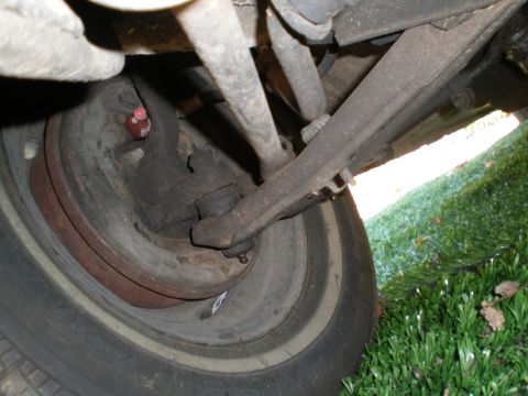 1966 Ford Mustang - Underside view of a vehicle's front suspension system and tire.