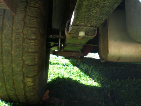 1966 Ford Mustang - Underside view of a vehicle's tire and suspension system.