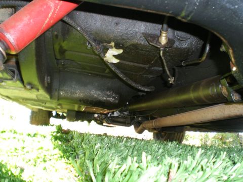 1966 Ford Mustang - Underside view of a 1966 Ford Mustang, highlighting the driveshaft and suspension components.