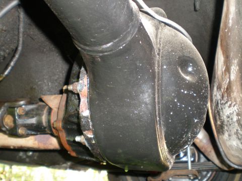 1966 Ford Mustang - Close-up of a vehicle's rear differential and driveshaft assembly.