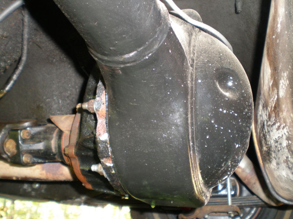 Underside view of a rear differential housing and driveshaft connection
