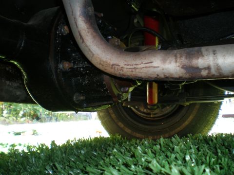 1966 Ford Mustang - Undercarriage view of a 1966 Ford Mustang, showing the rear axle and exhaust system.